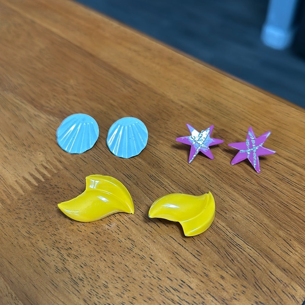 Vintage earrings. 80’s, 90’s. White, yellow and pink with silver stripes. Metal